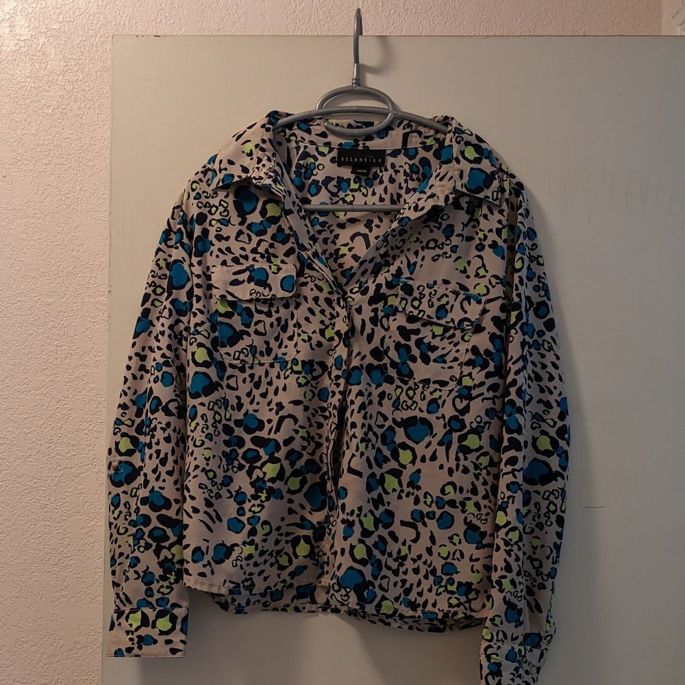Attention multi-color animal print blouse size medium.